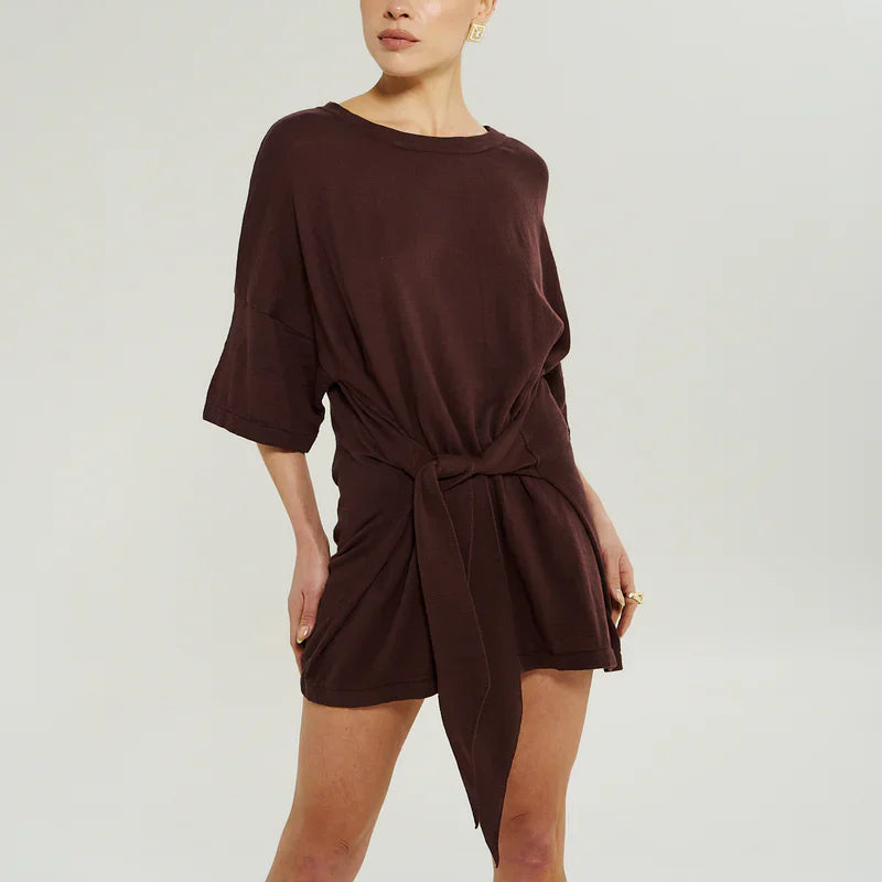 Model wearing sumi brown dress with tie front