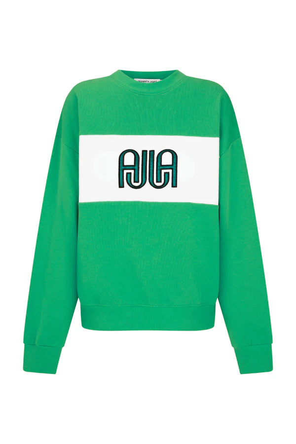 Green sweater with a white rectangle featuring a logo on a white background
