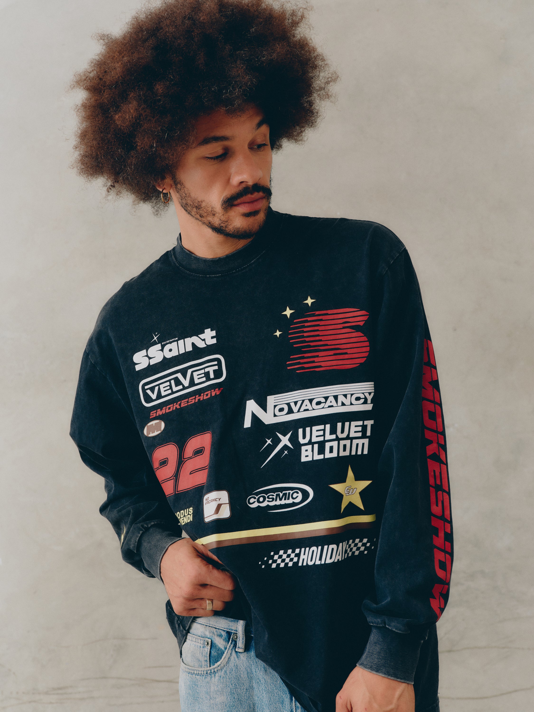 Model man wearing SSAINT Signature Moto Long Sleeve in Black Acid Wash oversized fit -unisex