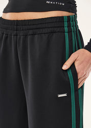 Close-up of contrast stripe detail and  PE Nation Clarity Trackpant