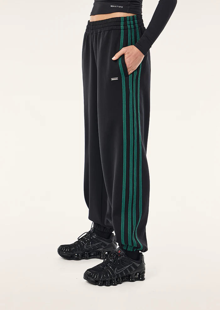 PE Nation Clarity Trackpant in black, side profile, regular fit