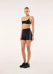 model shot wearing PE Nation Cypher Bike Short in Black Bean & Soft Yellow — high-rise squat-proof activewear short, Wild West Sisters