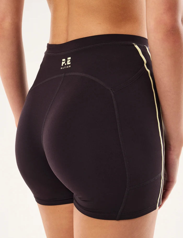 back view PE Nation Cypher Bike Short in Black Bean & Soft Yellow — high-rise squat-proof activewear short, Wild West Sisters