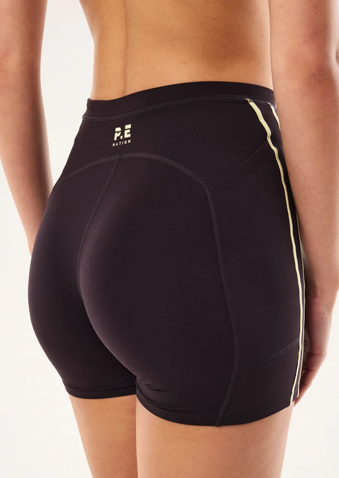 back view PE Nation Cypher Bike Short in Black Bean & Soft Yellow — high-rise squat-proof activewear short, Wild West Sisters