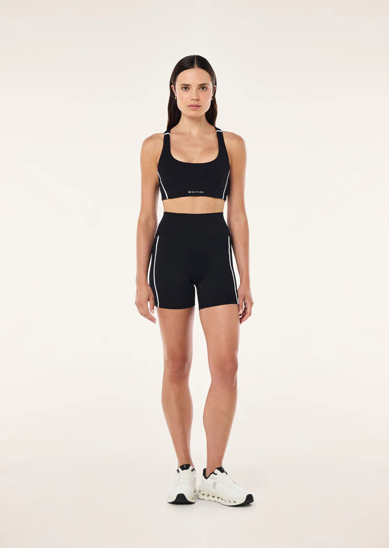 Model wearing PE Nation Dynamic 5" Bike Short for training