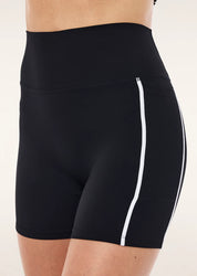 Close-up of contrast side panels and flatlock seams on PE Nation bike short