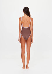 back view with model The Upside Galaxia Flow one piece swimsuit in chocolate metallic – Wild West Sisters