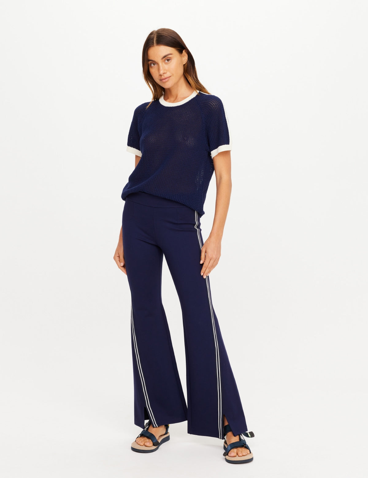 The Upside Joyela Panelled Flare Pant in navy with striped side seam tape with matching fenway jordan knit