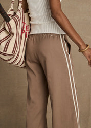 The Upside Juliet Pant Mocha worn by model back view embroidered logo