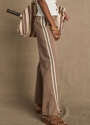 The Upside Juliet Pant Mocha split hem and contrast bind close up detail