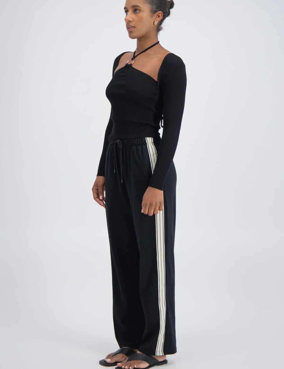 Panarea Trackpant detail — white side stripe and elastic waistband
