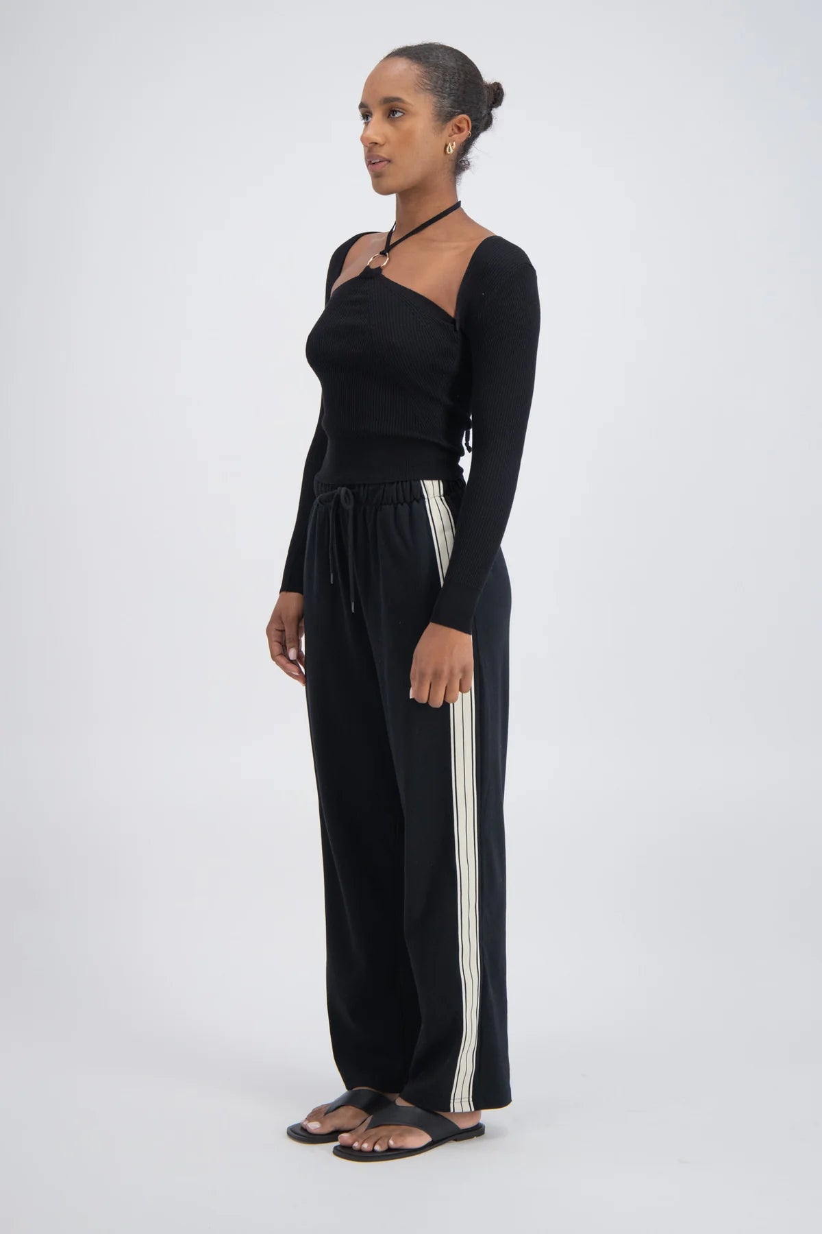Panarea Trackpant detail — white side stripe and elastic waistband