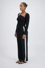 Panarea Trackpant detail — white side stripe and elastic waistband