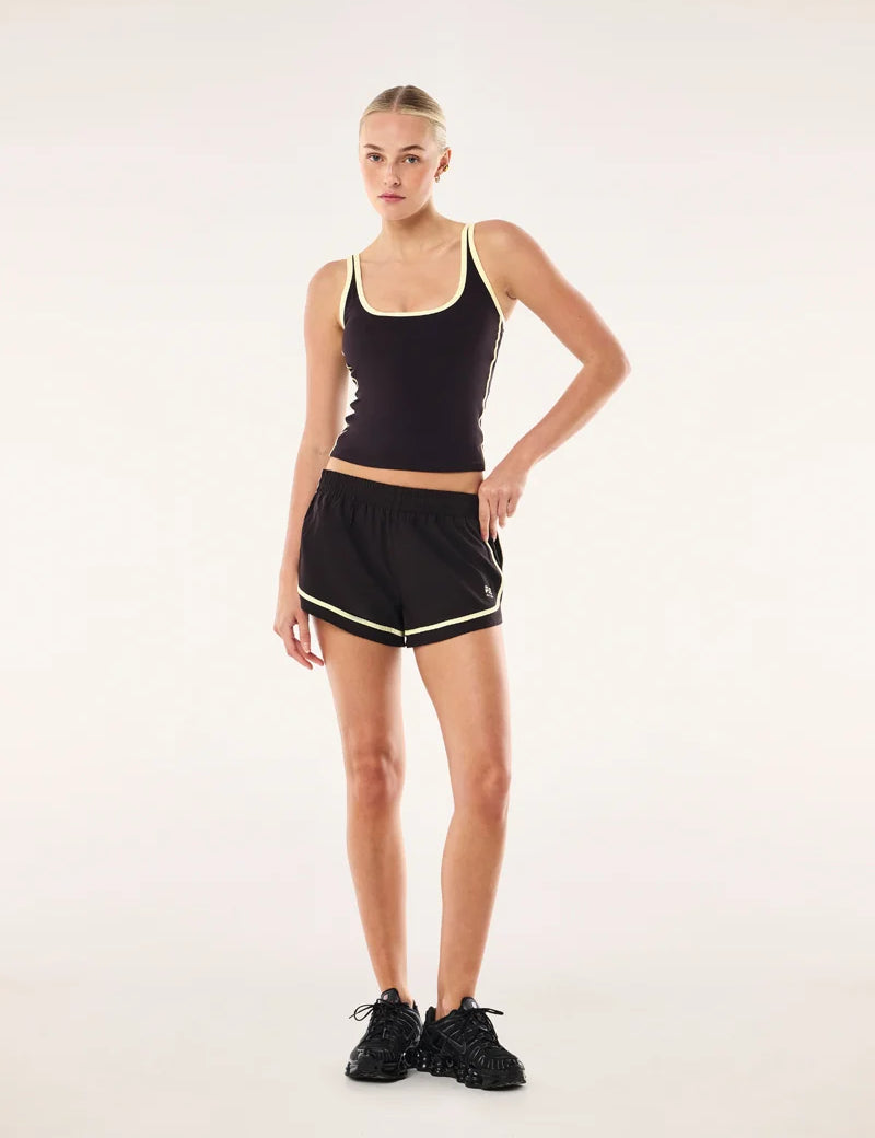PE Nation Stride Running Short in Black Bean & Soft Yellow — lightweight 4-way stretch active short, Wild West Sisters