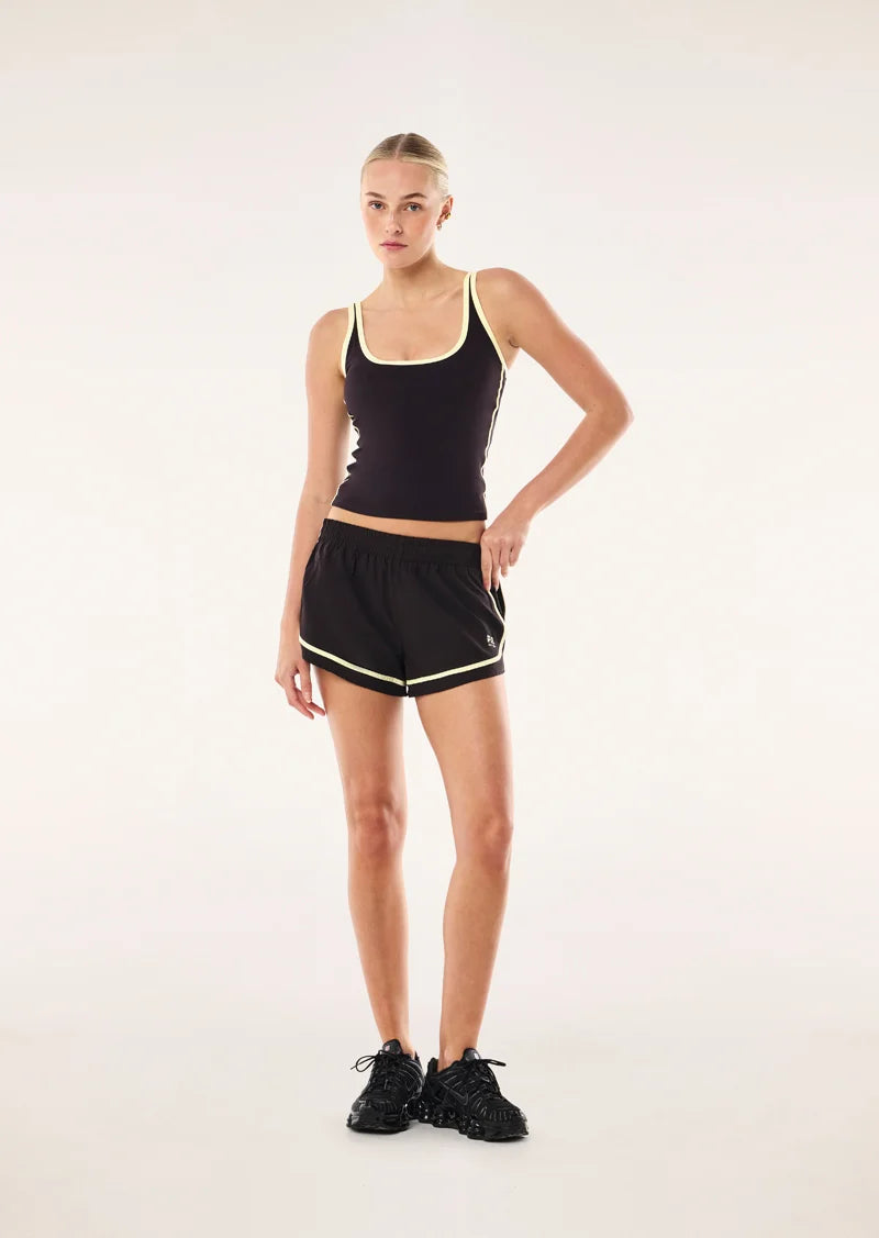 PE Nation Stride Running Short in Black Bean & Soft Yellow — lightweight 4-way stretch active short, Wild West Sisters