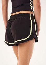 BACK VIEW PE Nation Stride Running Short in Black Bean & Soft Yellow — lightweight 4-way stretch active short, Wild West Sisters