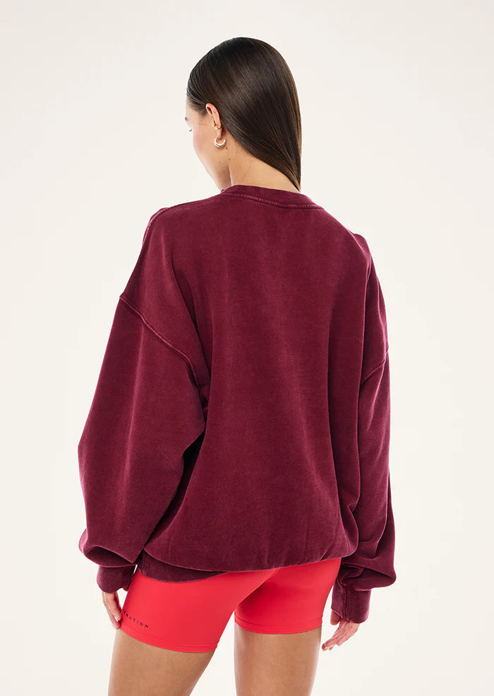 Back view of P.E Nation Swerve 2.0 Sweat Washed Cabernet oversized sweatshirt