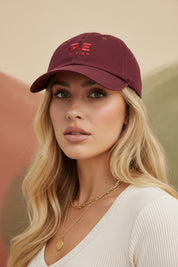 PE NATION CAP WITH MODEL WEARING IT 