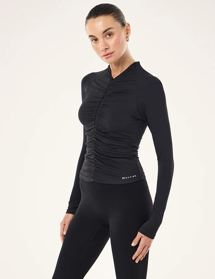 PE Nation Off Duty Long Sleeve Top in black styled with leggings, activewear outfit