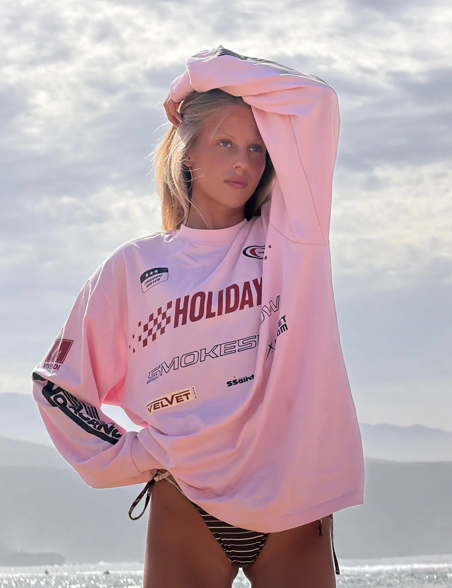 Close-up of Ssaint graphic print on pink Moto Tee, premium cotton, Wild West Sisters