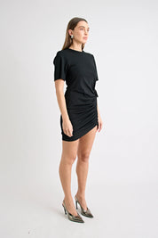 Woman wearing a black dress on a white background
