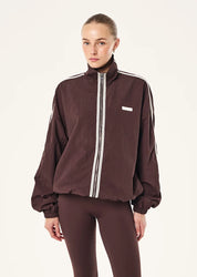 MODEL WEARING P.E Nation Radius Jacket in Dark Plum - oversized funnel neck jacket with side stripe detail