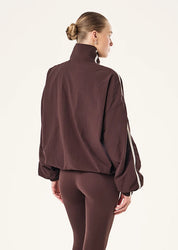 back view P.E Nation Radius Jacket in Dark Plum - oversized funnel neck jacket with side stripe detail