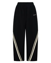 ŚSAINT Barrel Trackpant in black with butter double side stripe detail