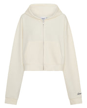 ŚSAINT Cropped Hoodie in butter with navy embroidered logo detail