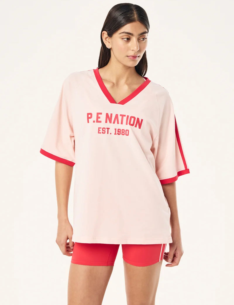 P.E Nation Spinout Baseball Tee in Soft Pink - oversized organic cotton jersey with contrast binding