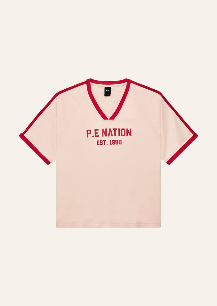 flatlay P.E Nation Spinout Baseball Tee in Soft Pink - oversized organic cotton jersey with contrast binding