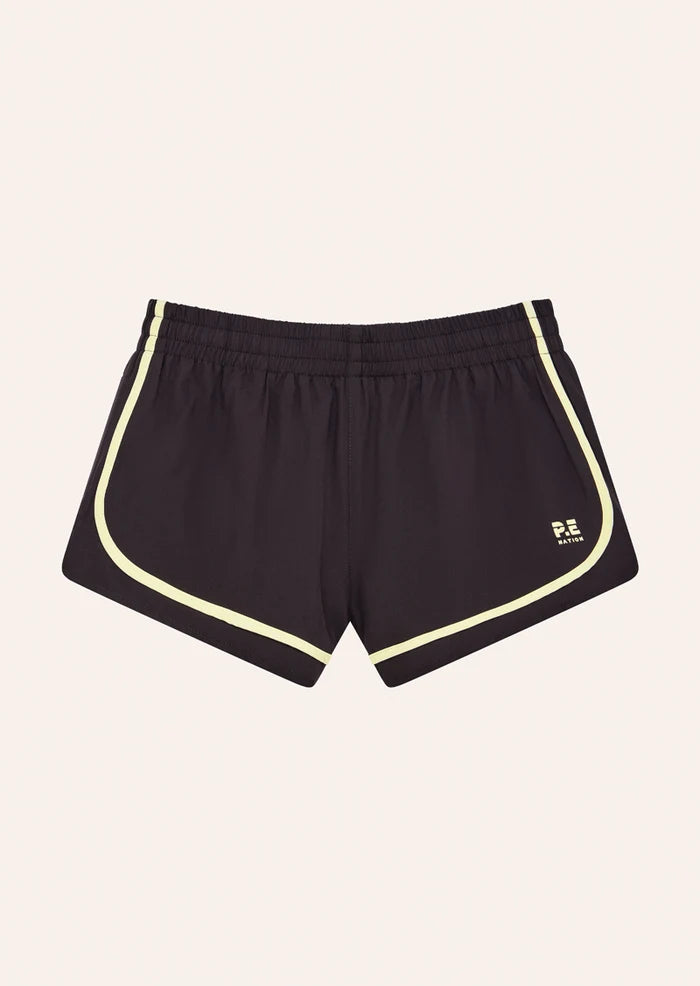 FLAT LAY PE Nation Stride Running Short in Black Bean & Soft Yellow — lightweight 4-way stretch active short, Wild West Sisters