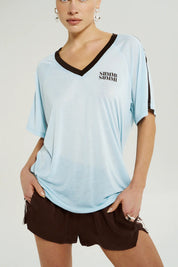 Summi Summi V-Neck Jersey Tee in Icel Blue, lightweight knit tee with contrast chocolate binding and front logo.