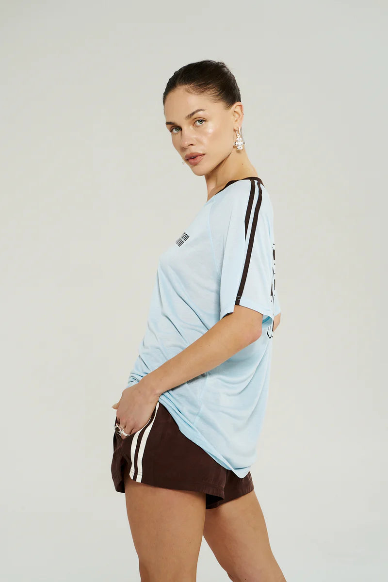 Model wearing Summi Summi V-Neck Jersey Tee in Icel Blue styled for an elevated everyday look