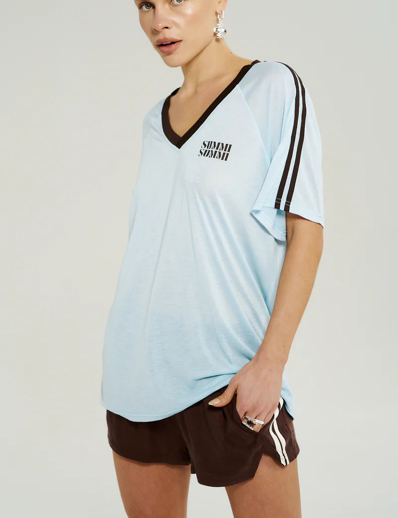 “Side view of Summi Summi V-Neck Jersey Tee in Icel Blue showing V-neckline and subtle shoulder stripe detail.”