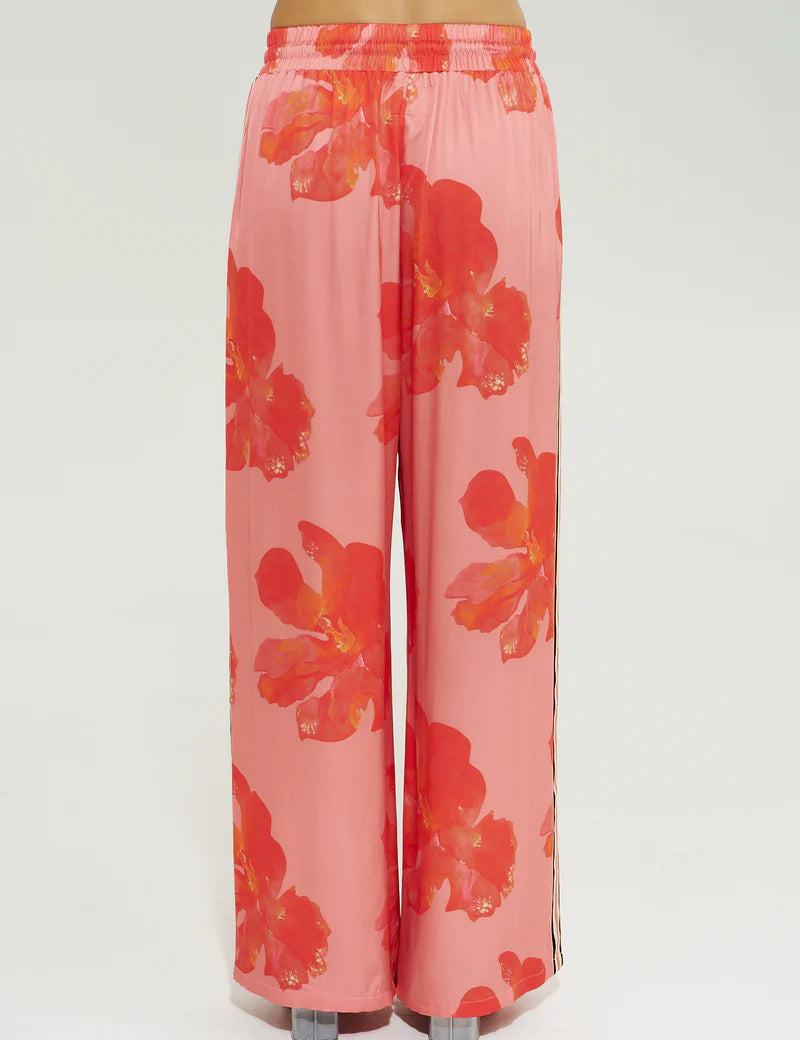 Model wearing Summi Summi La Vie Wide Leg Pant in Peach Petals print with wide leg silhouette