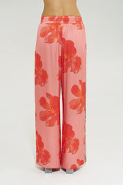Model wearing Summi Summi La Vie Wide Leg Pant in Peach Petals print with wide leg silhouette