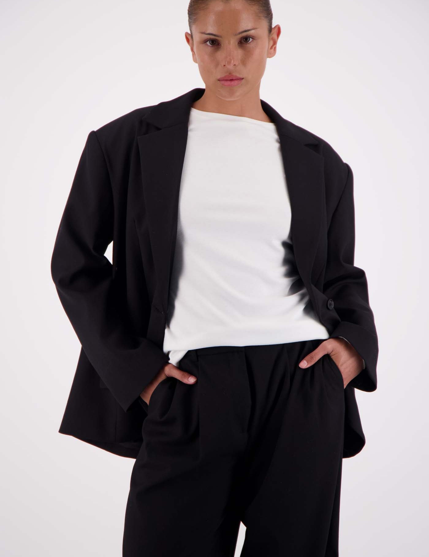 Jasmine Alexa Sabine Blazer Black worn open over white top and wide-leg trousers, relaxed silhouette