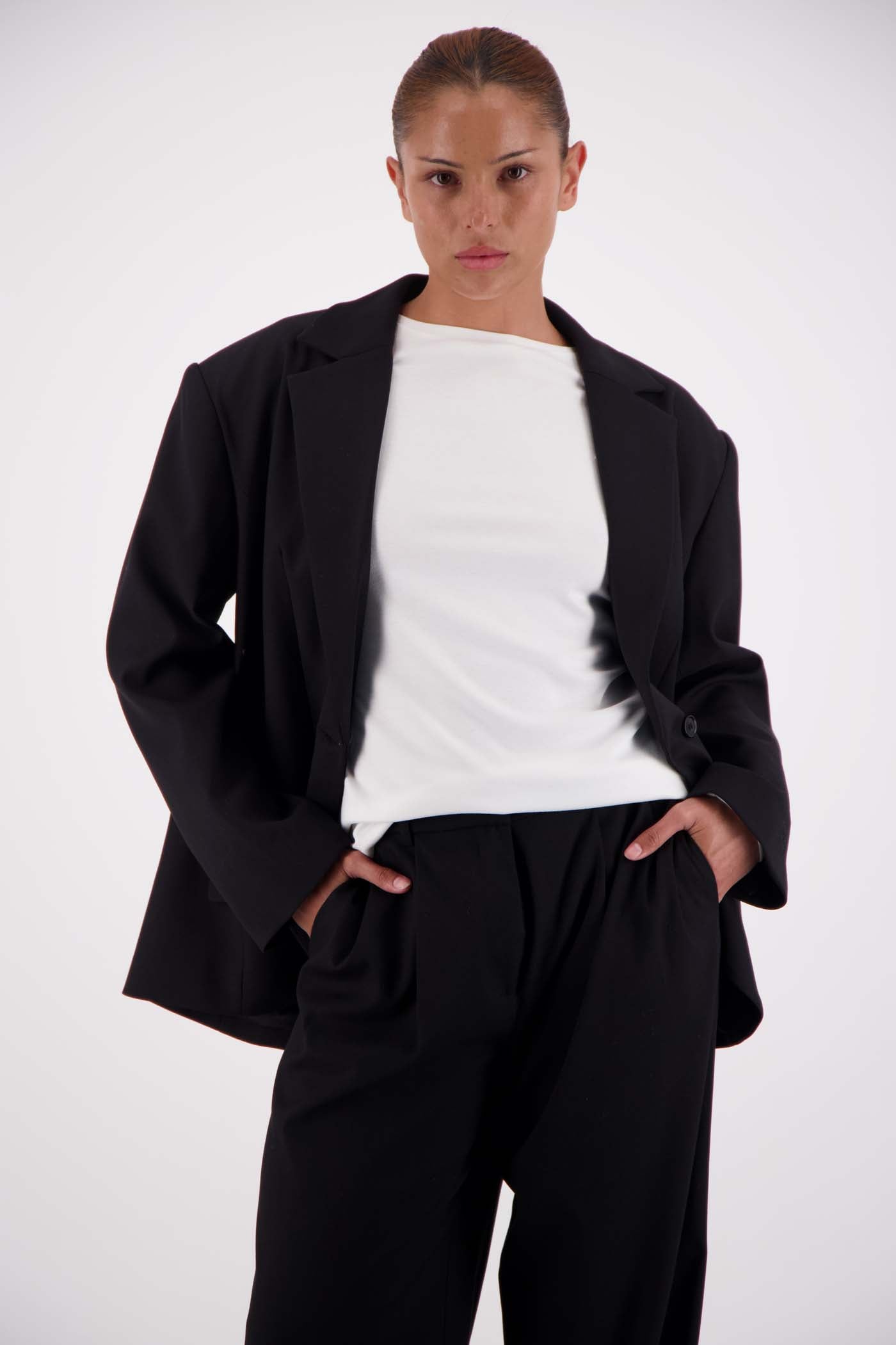 Jasmine Alexa Sabine Blazer Black worn open over white top and wide-leg trousers, relaxed silhouette