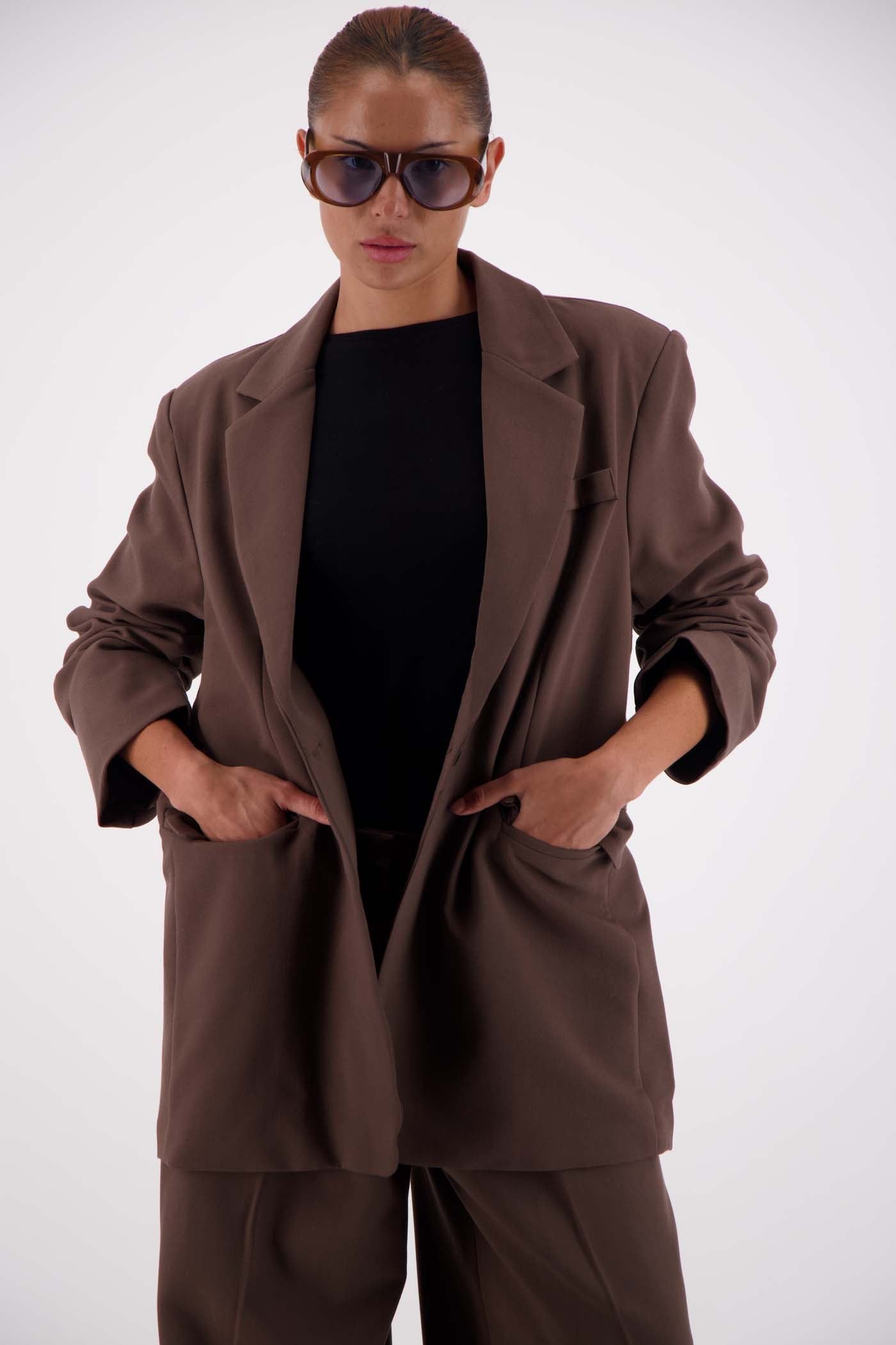 Jasmine Alexa Sabine Blazer Taupe worn open, model hands in pockets, styled with matching taupe trousers