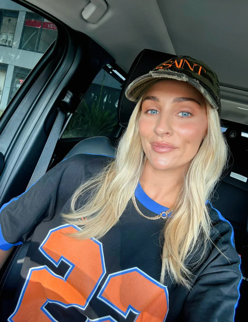 Ssaint Twenty Two Tee in black with bold orange 22 graphic, oversized unisex fit, Wild West Sisters