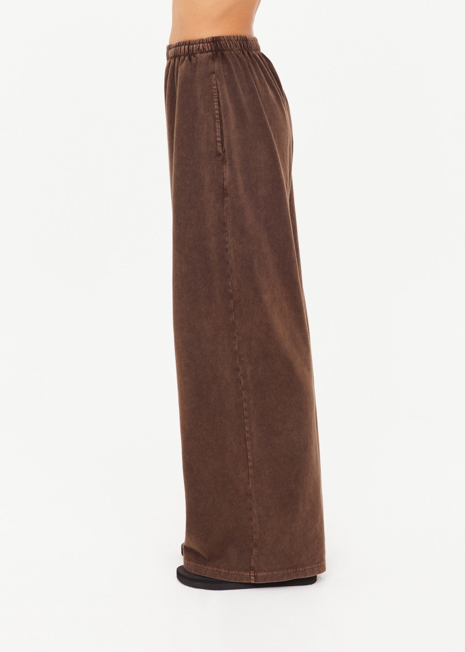 side view of The Upside Soho Tokio Wide Leg Pant in Cocoa showing embroidered arrow logo detail
