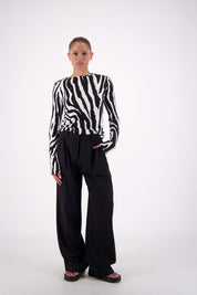 front view Model wearing Jasmine Alexa Soho Zebra Top with tailored trousers