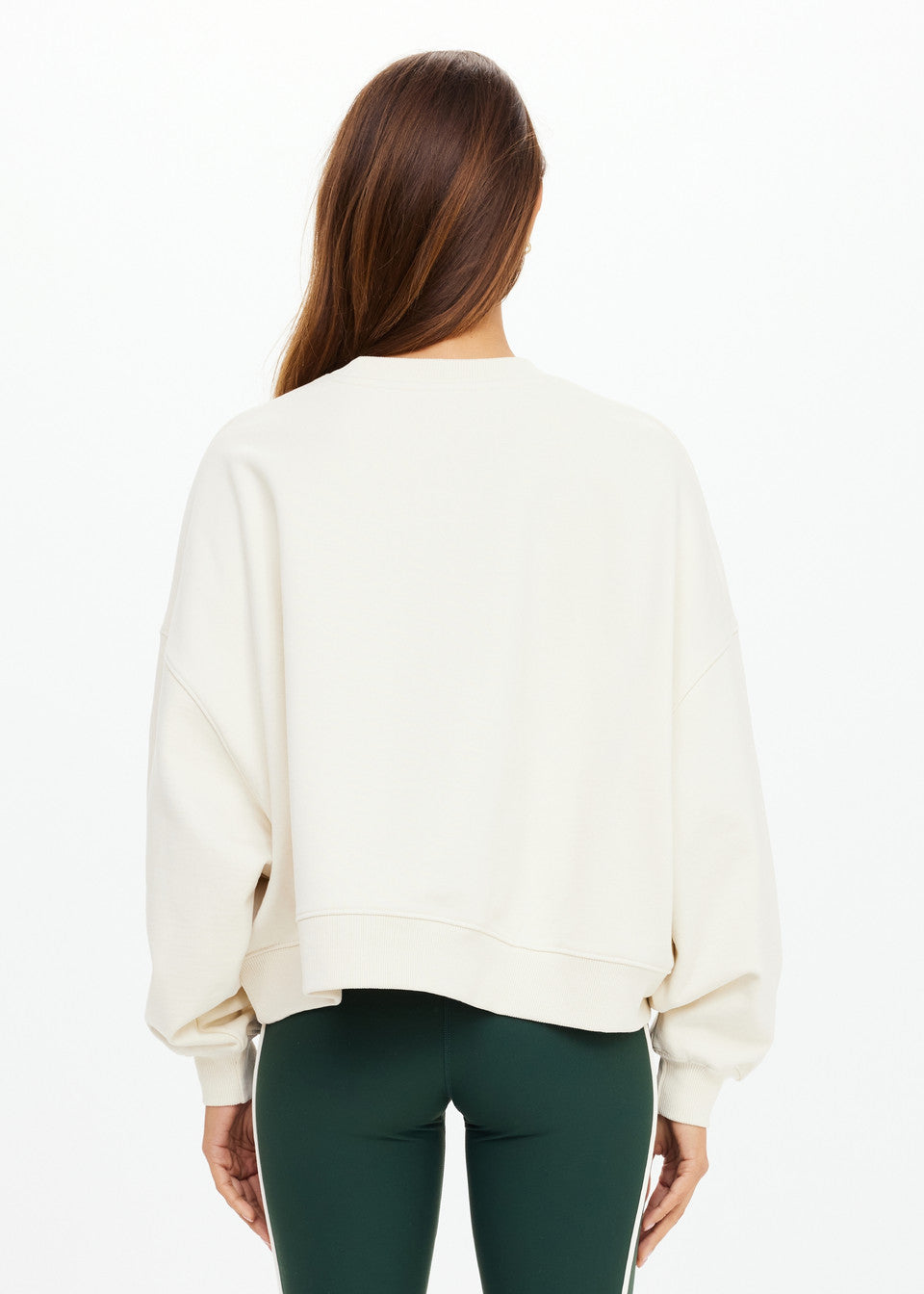 “Back view of The Upside Molokai Paloma Crew in cream with oversized boxy silhouette.”