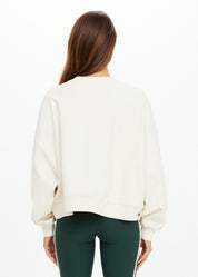 “Back view of The Upside Molokai Paloma Crew in cream with oversized boxy silhouette.”