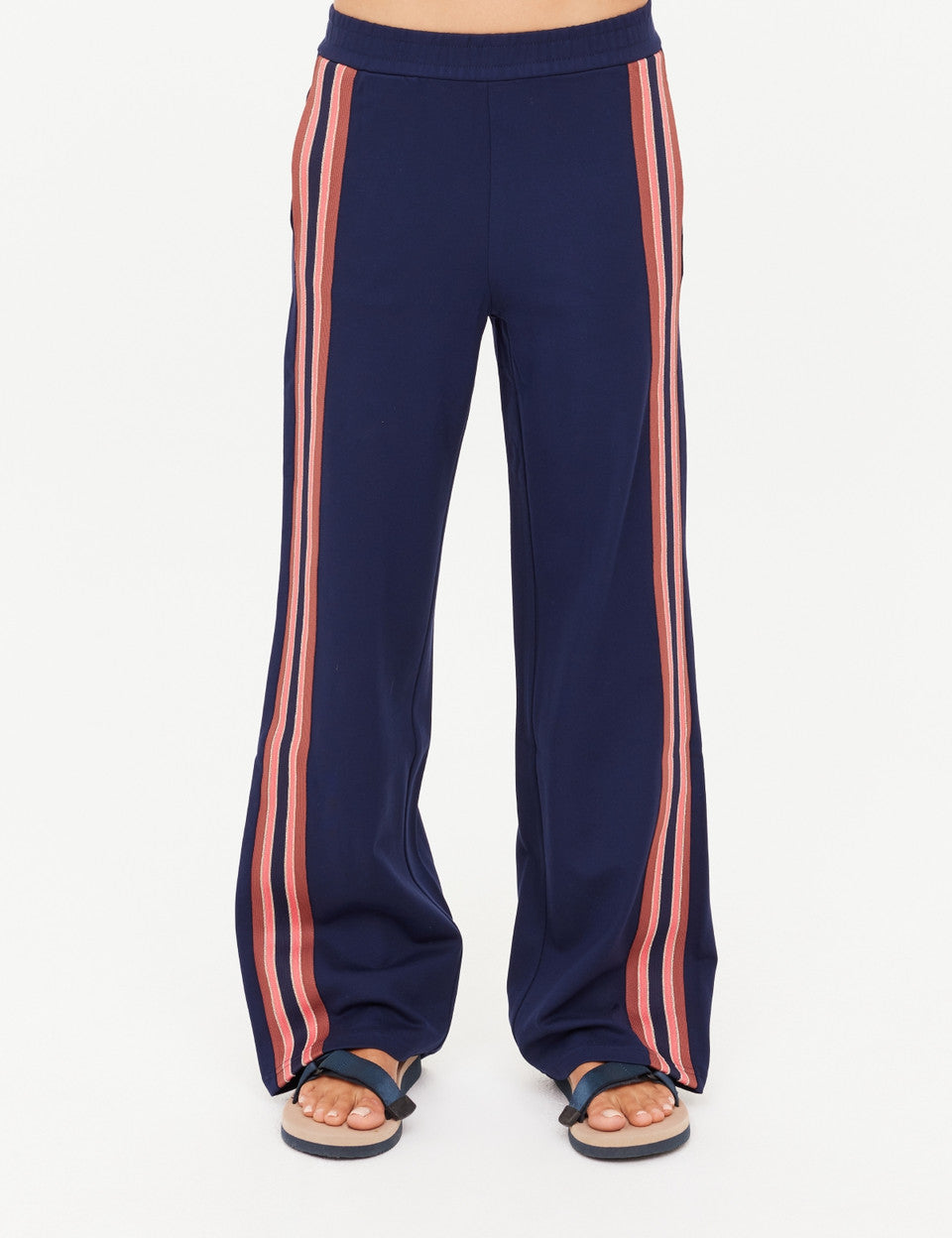 Navy pants with pink stripes on a white background