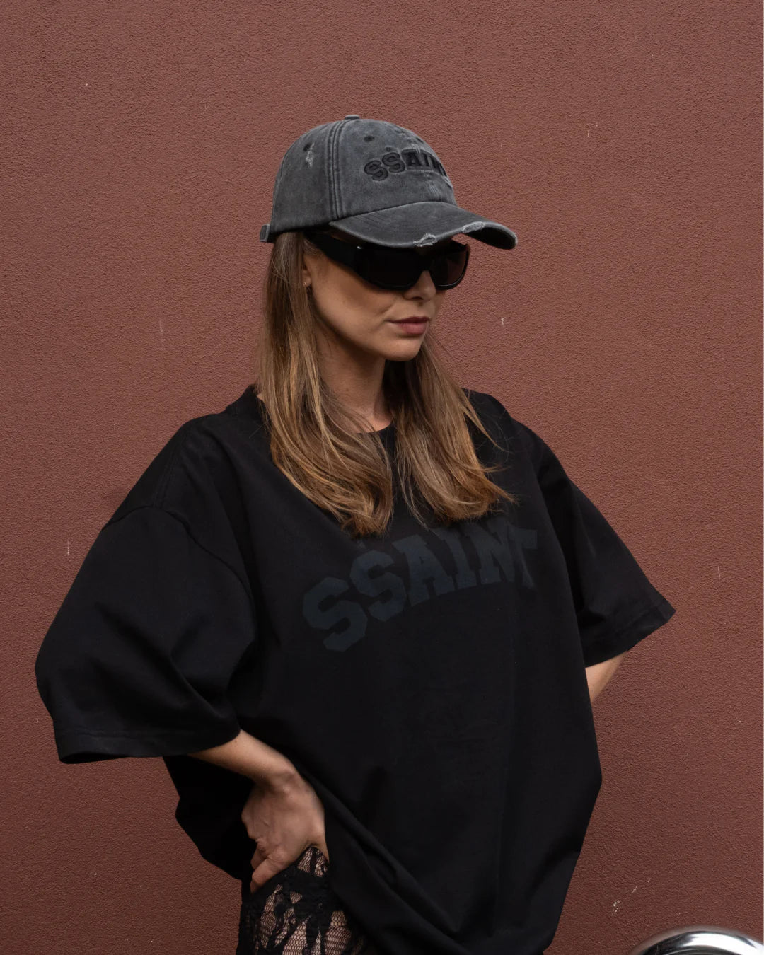 SSAINT Logo Cap in black acid wash with embroidered logo and velcro closure