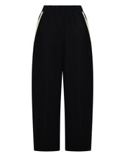 BACK VIEW ŚSAINT Barrel Trackpant in black with butter double side stripe detail