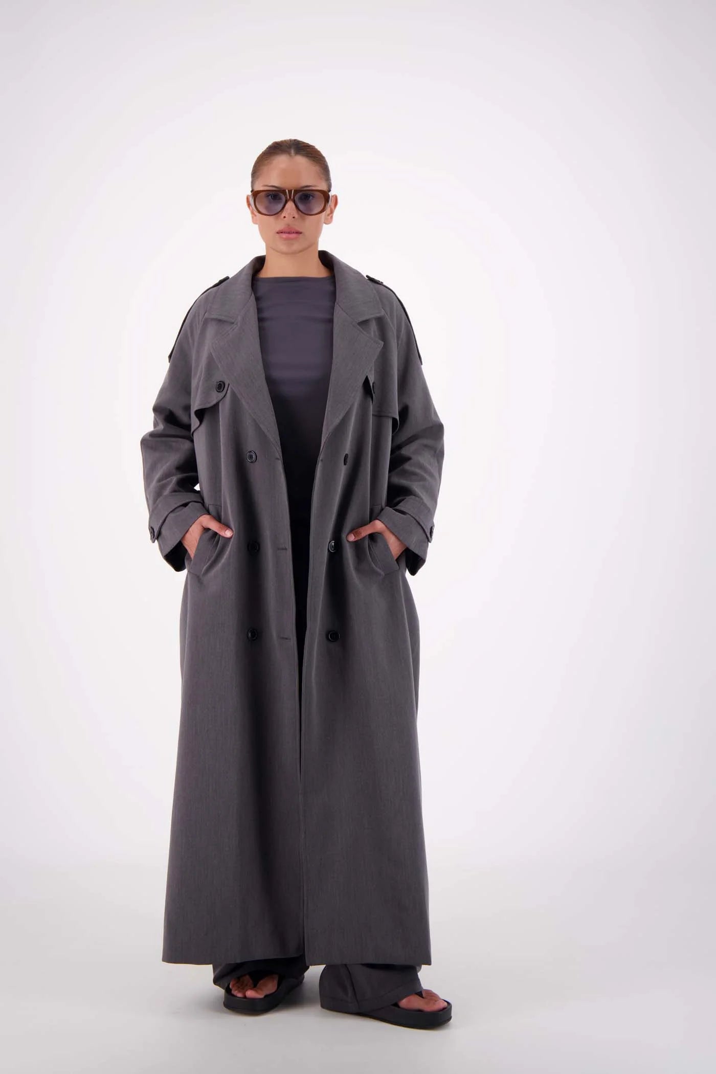 Serena Trench detail — shoulder epaulettes and button closure steel grey