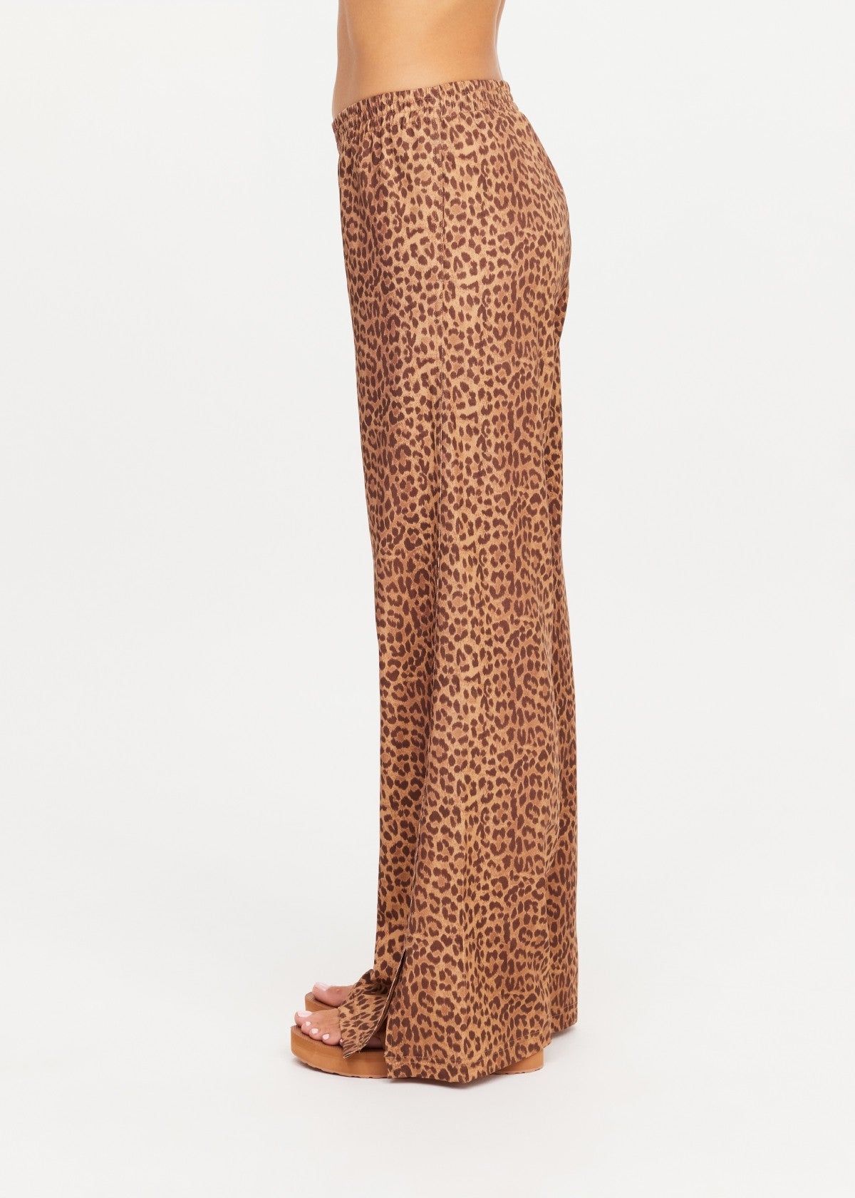 The Upside Javan Juliet Pant in leopard print, low rise with split hem detail side view